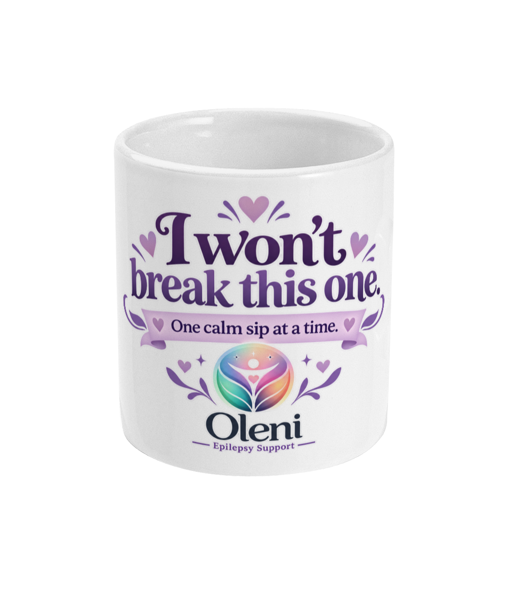 White Oleni ceramic mug with “I won’t break this one – One calm sip at a time” design